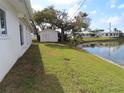 Backyard with shed and grassy area, next to the lake at 4251 96Th N Ter, Pinellas Park, FL 33782