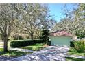 House exterior showcasing green garage door and driveway at 5873 Meadowpark Pl, Lithia, FL 33547