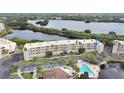 Condo building with pool and parking, situated on a waterfront property at 6315 Shoreline Dr # 3208, St Petersburg, FL 33708