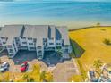 Condo building's aerial view showcasing waterfront access at 828 Bahia Del Sol Dr # 59/ A, Ruskin, FL 33570