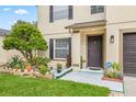 House entrance with landscaping and a walkway at 14003 Fareham Rd, Odessa, FL 33556