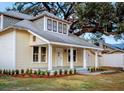 Well maintained craftsman home with a large front porch and mature oak tree at 1404 W Granfield Ave, Plant City, FL 33563