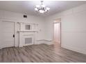 Bright living room featuring hardwood floors, fireplace, and built-in bench at 1404 W Granfield Ave, Plant City, FL 33563