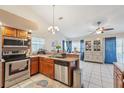 Open kitchen with stainless steel appliances and ample counter space at 1534 Ridge Shore Dr, Tarpon Springs, FL 34689