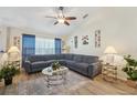 Spacious living room featuring a sectional sofa and wood-look floors at 1534 Ridge Shore Dr, Tarpon Springs, FL 34689