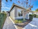 Home exterior showcasing a walkway leading to the front entrance at 15856 Cobble Mill Dr, Wimauma, FL 33598