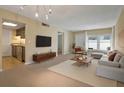 Living room with open floor plan and kitchen view at 1799 N Highland Ave # 99, Clearwater, FL 33755