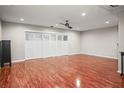 Hardwood floor living room with sliding doors to a patio at 1801 E Lake Rd # 15C, Palm Harbor, FL 34685