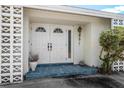 House entrance with double doors and decorative screen at 2389 Sarazen Dr, Dunedin, FL 34698