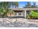 Covered carport with access to the house and backyard at 4020 S West Shore Blvd, Tampa, FL 33611