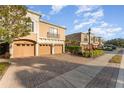 Three-unit building with a paved driveway and sidewalks at 4079 Overture Cir # 346, Bradenton, FL 34209