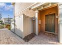 Dark brown front door with a white fence to the left at 4079 Overture Cir # 346, Bradenton, FL 34209