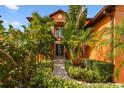 Welcoming entryway with lush landscaping and a stone pathway at 4414 Waltham Dr, Tampa, FL 33634