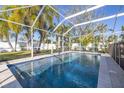 Inviting swimming pool with a screened enclosure at 5720 Venetian Ne Blvd, St Petersburg, FL 33703