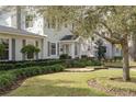 House exterior showcasing gray siding and well-maintained landscaping at 620 26Th N Ave, St Petersburg, FL 33704