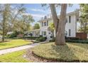 Two-story house with gray siding, landscaping, and a walkway at 620 26Th N Ave, St Petersburg, FL 33704