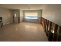 Under renovation living room with exposed walls and flooring at 1019 Mandalay Ave, Clearwater Beach, FL 33767