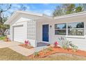 Charming entryway with a new door and modern landscaping at 11395 83Rd Ave, Seminole, FL 33772