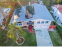 Top-down view of house showcasing solar panels and pool at 14311 83Rd Pl, Seminole, FL 33776