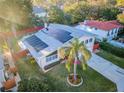 House with solar panels, pool, and lush landscaping at 14311 83Rd Pl, Seminole, FL 33776