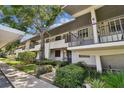 Front view of a condo building showcasing its architecture and landscaping at 1601 43Rd N St # 133, St Petersburg, FL 33713