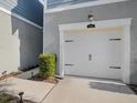 White garage door with black accents at 3010 Palm Key Ave, Oldsmar, FL 34677