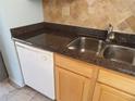 Kitchen with granite countertops and light wood cabinets at 3300 Cove Cay Dr # 6G, Clearwater, FL 33760