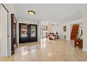 Spacious foyer with decorative tile flooring, large front door, and staircase leading to upper level at 3903 Sand Dollar Pl, Tampa, FL 33634