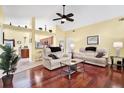 Living room with hardwood floors, recessed lighting and view of kitchen at 393 Waterford E Cir, Tarpon Springs, FL 34688