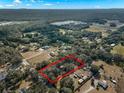 Aerial view showcasing home and surrounding landscape at 5104 Nesmith Rd, Plant City, FL 33567