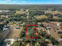 Aerial view of property with home and surrounding area at 5104 Nesmith Rd, Plant City, FL 33567