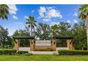 Avalon Park community entrance with brick pillars and lush landscaping at 5200 Suncatcher Dr, Wesley Chapel, FL 33545