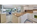 Kitchen with granite countertops and white cabinets at 6343 Palma Del Mar S Blvd # 225, St Petersburg, FL 33715