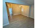 Bright dining area with modern light fixture and wood-look floors at 8014 N Alaska St, Tampa, FL 33604