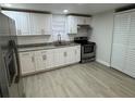 Updated kitchen with stainless steel appliances and granite countertops at 8014 N Alaska St, Tampa, FL 33604