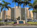 Regatta Beach Club building exterior view with parking at 880 Mandalay Ave # N111, Clearwater Beach, FL 33767