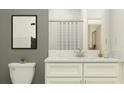 Modern bathroom with white vanity, quartz countertop, and gray walls at 10601 Gable Dig Loop, San Antonio, FL 33576