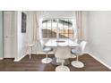 Bright dining area with a modern white table and four chairs at 1212 Markley Dr, Largo, FL 33770