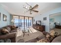 Bright living room with ocean view and access to balcony at 15462 Gulf Blvd # 603, Madeira Beach, FL 33708