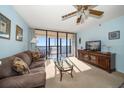 Living room with ocean view and comfortable seating at 15462 Gulf Blvd # 603, Madeira Beach, FL 33708
