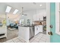 Modern kitchen with stainless steel appliances and granite countertops at 223 Sun Vista S Ct, Treasure Island, FL 33706