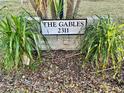 The Gables 2311 building sign with landscaping at 2311 Brisbane St # 65, Clearwater, FL 33763