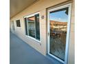 Condo entry with glass door and balcony view at 2311 Brisbane St # 65, Clearwater, FL 33763
