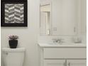 Simple bathroom with single sink and toilet at 2635 Sunray Venus Way, Ruskin, FL 33570