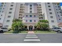 Beautiful condo building entrance with meticulous landscaping and convenient parking at 2825 Terra Ceia Bay Blvd # 1504, Palmetto, FL 34221