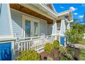 Inviting front porch with rocking chairs and lush landscaping at 2911 53Rd S St, Gulfport, FL 33707