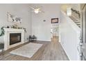 Spacious living room with a fireplace, high ceilings, and hardwood floors at 3118 W Hartnett Ave, Tampa, FL 33611