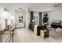Bright living room with comfortable seating and hardwood floors at 351 46Th N Ave, St Petersburg, FL 33703