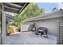 Cozy patio with wicker furniture and stone flooring at 5340 Cobblestone Ct, Wesley Chapel, FL 33543