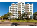 Modern, multi-story Harbour Hill building with balconies and palm trees at 700 Beach Ne Dr # 401, St Petersburg, FL 33701